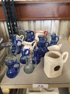 lot 32 image: Selection of small pitchers
