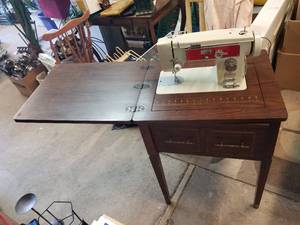 lot 141 image: Brother Sewing machine in cabinet