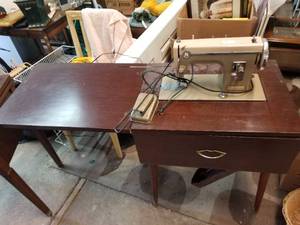 lot 142 image: Kenmore Sewing machine in cabinet
