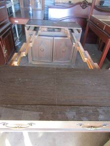 lot 1 image: Midcentury 1800 Saginaw wood dining table. Seats 12-14. Buffet style pill out . Pulled out 9 8 closed 30x36