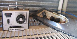 lot 7 image: Airtronics serial#830991 remote with handmade boat (needs repair)