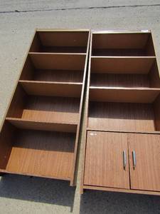lot 13 image: 2 bookshelves . One has a cabinet in the bottom 59x24x0.5