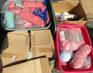 lot 40 image: 4 tubs full of yarn and fabric