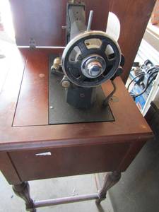 lot 61 image: Kenmore model 83 sewing machine in cabinet