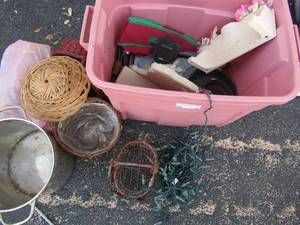 lot 72 image: 1 small 1 large cast iron skillets, christmas lights, purses, wicker basket and doll chair