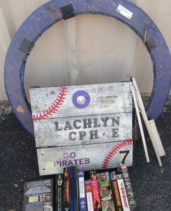 lot 74 image: Handmade wooden sign, 10 VHS tapes, 2 DVDs, small metal easel, circle wooden frame 30