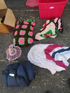lot 77 image: Assorted afghans all sizes, yarn doll and sleeping bag.