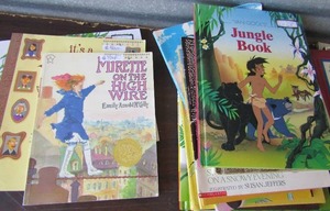 lot 83 image: Kids hard back books by Scholastic- Miracle story book, my first Muppet and more