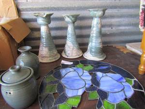 lot 90 image: Kelly M Pottery 96 Incense burners 3 matching clay candle holders 10, 11 and 12 1 has a broken lip 16 diameter stain glass window hanger  blue flower design