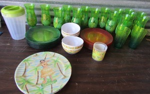 lot 100 image: Evolution Hawaii plastic dish set plates,x4, 30 red and green plates, 5 bowls, water pitcher 15 tall cups and 2 tea cups