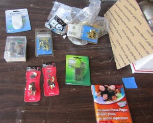 lot 103 image: Box of shelf support pens, screws, nails, hinges, brick hangers, corner wedges