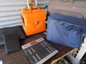 lot 104 image: Computer bag, bible cover, bathroom scale, rolling office bag, blue and gray suitcase