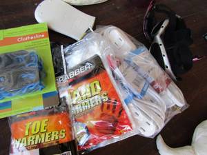 lot 107 image: New hand warmers, 2 pair motorcycle glasses NIP clothesline,  NEW 4 multi plug extension cords