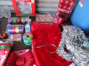 lot 114 image: Christmas garland, tree skirt, ribbon, lights, tree topper star and more