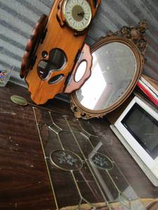 lot 134 image: 2- 26 12 glass window insets,   wooden wall clock with mirror stands 30,    31x16 mirror