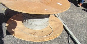 lot 250 image: 1 used large spool of gray electric house wire