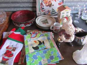 lot 262 image: 11 light up angel (3 AAA batteries), General store light house, 12 Ginger bread plate, 4 Christmas dinner plates, 1981 Wally Santa with toy bag, plus stockings and gift bags