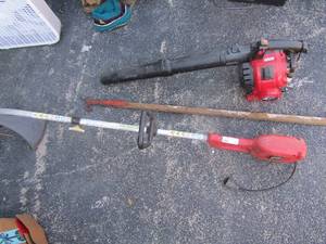 lot 270 image: Homelite electric weed eater,  troy built 4 cycle gas blower,  limb trimmer