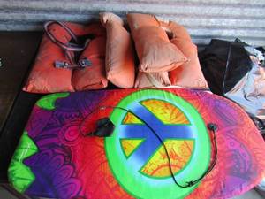 lot 281 image: Kids wave board water toy & 3 orange adult life jackets
