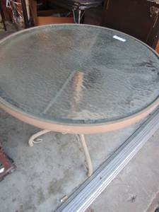 lot 293 image: Oval glass top outdoor table 29x25