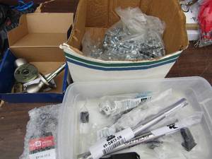 lot 330 image: Lot- Screw drivers, washers, locked door knob with no key, 2 black wheels for desk chair Everbuilt spring door stops and canopy pull connectors