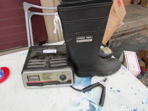 lot 336 image: Shumaker battery charger unknown working condition. Rubber work boots with steel toe size 7 mens