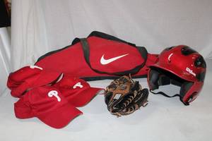 lot 41 image: Sports Lot Nike Baseball Bag with Bat, Wilson Helmet, KDR 1100 Glove and Ball Caps