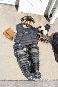 lot 80 image: All-Star Catchers Equipment Face Shield, Chest Pad, Shin Guards, 2 Baseball Gloves and Balls