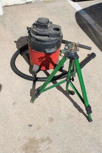 lot 84 image: Tripod Sprinkler and 5 Gallon Shop-Vac