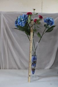 lot 150 image: 2 Ft. Tall Narrow Glass Vase with Extra Long Flowers and Glass Beads