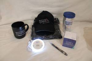 lot 210 image: Allstate  National General NEW and UNUSED branded logo items. Includes hat, Coffee mug, Water bottle, Computer clip light, Quarter zippered pullover (sealed, )pen and more