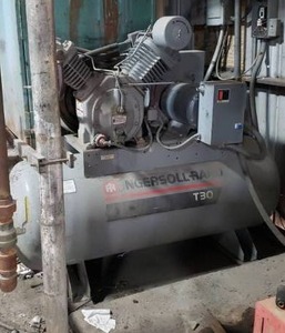lot 5 image: Ingersoll Rand 120-Gallon T30 Air Compressor, Model 7100E15.  Currently in Operation.  Buyer Responsible for Disconnecting.