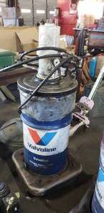 lot 176 image: Graco Fire Ball Pump w 120 lb Valvoline VV611 Grease & Rolling Barrell Dolly, Drum is full