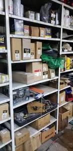 lot 669 image: Contents of Shelf.  Misc Oil Filters, Gauges, Lines & Straps.  Shelf Not Included.  THIS ITEM MUST BE PICKED UP WEDNESDAY OR THURSDAY
