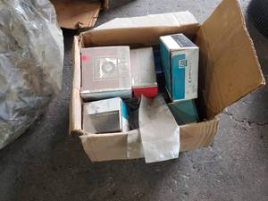 lot 232 image: Box of GM and Delco Parts - Glow Plug Controller, Valve Assembly, Hub Bearing Lock, and More
