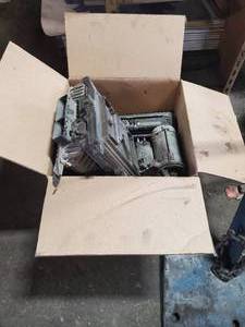 lot 314 image: Box of Vehicle Electronics. Mack Engine Control Module, Voltage Regulator, Radios & More