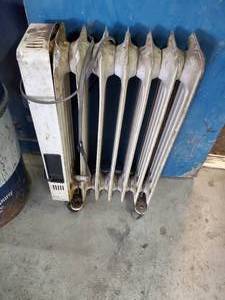 lot 413 image: DeLonghi Portable Radiator Heater