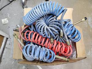 lot 496 image: Box Containing Several Coiled Air Hoses