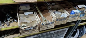 lot 529 image: Contents of Shelf - Contents Include Hub Nuts and Locks, Freeze Plugs, Air Brake Slack Adjuster, and More - Shelf NOT Included  THIS ITEM MUST BE PICKED UP WEDNESDAY OR THURSDAY