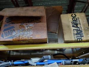 lot 535 image: Contents of Shelf.  Wheel covers, Lamp Covers, Misc Parts & More.  SHELF NOT INCLUDED  THIS ITEM MUST BE PICKED UP WEDNESDAY OR THURSDAY