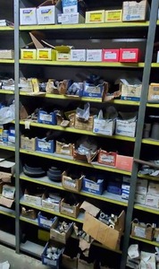 lot 660 image: Contents of Shelf - Automotive Brake Pads, Wheel Studs, and More - Shelf NOT Included  THIS ITEM MUST BE PICKED UP WEDNESDAY OR THURSDAY
