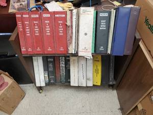 lot 828 image: Lot of Vehicle Service Manuals, Time Guides, Chilton Manuals & More.  Includes Rolling Book Cart.
