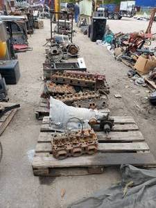 lot 996 image: Entire Contents of Row - Contents Include Heads, Transmission, Cart and More - SEE PHOTOS
