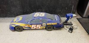 lot 829 image: RARE & Massive 16 Scale Nascar #55 Michael Waltrips Napa Toyota Camry RC Remote Control Car w Controls & Charging Cord.