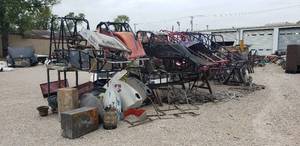 lot 980 image: Large Lot of Race Car Parts - Several Frames, Exhaust Parts, Suspension Parts, Body Panels, and More