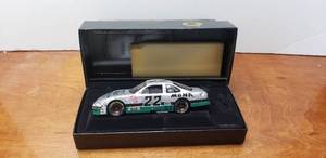 lot 878 image: Action Elite Diecast 124 1997 Ward Burton #22 Silver MBNA Pontiac, Limited Edition