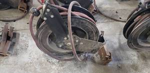 lot 1056 image: Retracting Hose Reel w 12 Air Hose & CeilingWall Mount