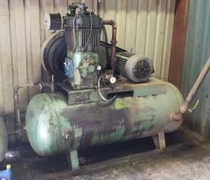 lot 1081 image: Large 120 Gallon Air Compressor w 3-Phase 15 HP Motor. Currently in Operation. Buyer Responsible For Disconnecting.