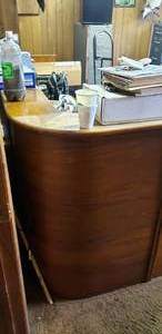 lot 1086 image: 4 x 8 Solid Wood Mid-Century Reception Desk.  Beautiful Curved Front Edge.  CONTENTS NOT INCLUDED.
