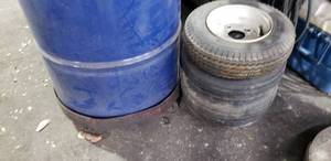 lot 138 image: Rolling 55 Gallon Barrel Stand & Small trailer Tires  BARRELL NOT INCLUDED